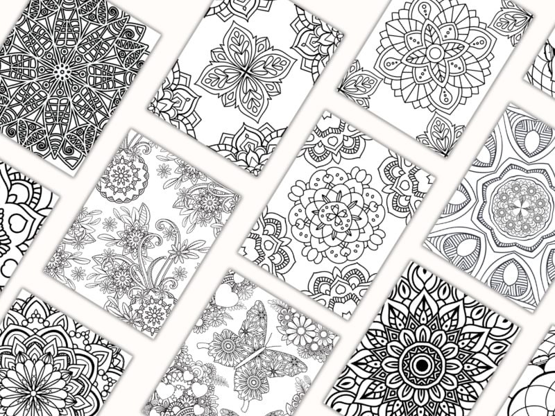 collection of mandala coloring pages on a counter top