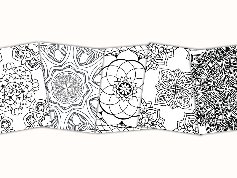 printable mandala coloring pages on a desk