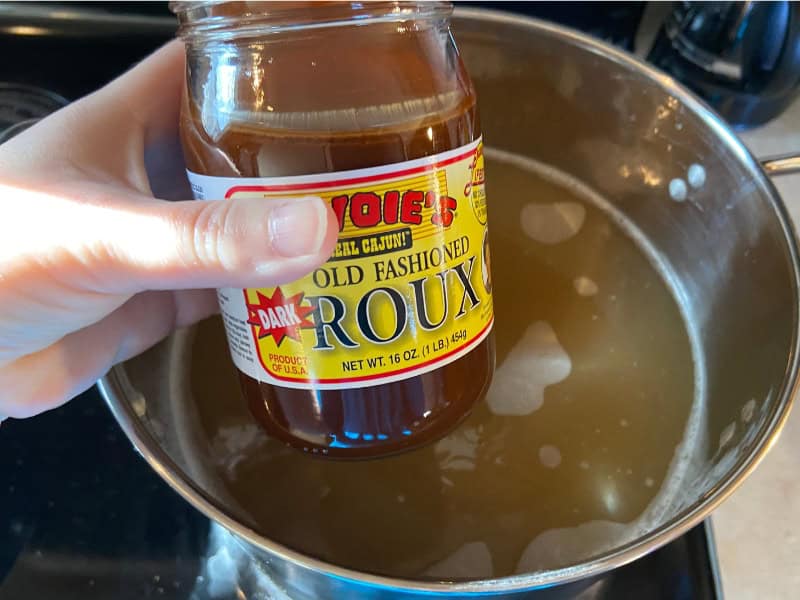 Gumbo pot and jar of old fashion dark roux